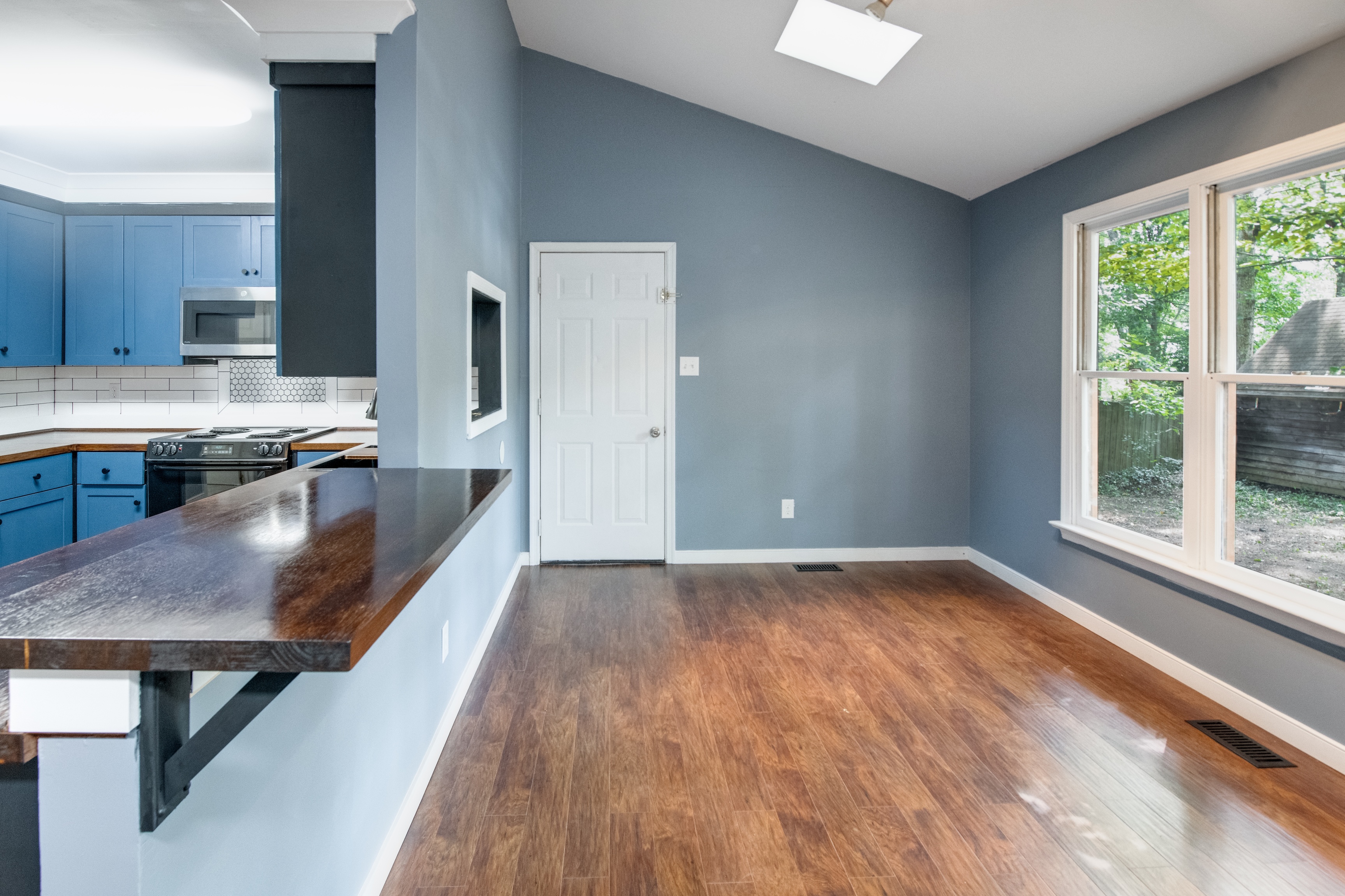 Unstaged professional photo of a vacant rental room